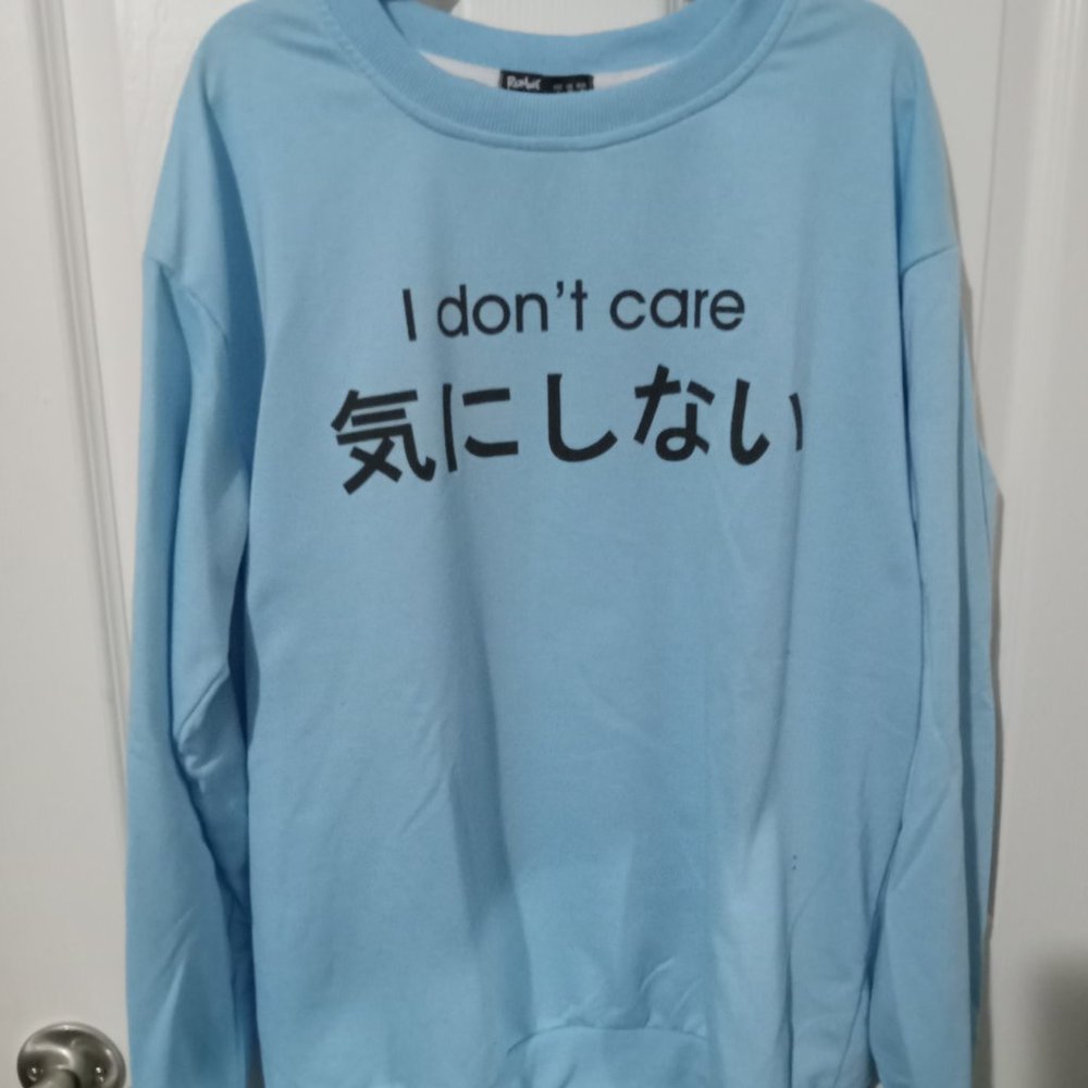 EUC mens/gender neutral baby blue "I Don't Care" sweater - size small